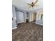 Bright living room featuring hardwood floors, fireplace and arched doorways at 1347 Carlyle Park Cir, Highlands Ranch, CO 80129