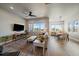 Bright living room featuring modern decor and seamless flow into the dining area at 7010 Homeplace Pt, Castle Rock, CO 80108