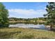Scenic community pond reflecting blue skies, perfect for relaxing nature walks at 7010 Homeplace Pt, Castle Rock, CO 80108