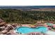 Resort-style pool area with lounge chairs, umbrellas, and scenic mountain views at 7010 Homeplace Pt, Castle Rock, CO 80108