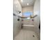 Bathroom shower with herringbone tile floor, bench seat, tiled walls, window, and glass enclosure at 7010 Homeplace Pt, Castle Rock, CO 80108