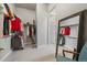 Spacious walk-in closet with shelving and a mirror, providing ample storage space at 7010 Homeplace Pt, Castle Rock, CO 80108