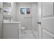 Updated bathroom with white vanity, marble shower, and modern fixtures at 181 E 108Th Ave, Northglenn, CO 80233