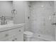 Clean bathroom with a white vanity and marble shower surround at 181 E 108Th Ave, Northglenn, CO 80233