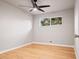Simple bedroom with hardwood floors and a ceiling fan at 181 E 108Th Ave, Northglenn, CO 80233