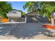 Modern two-story home with gray exterior, updated garage, and landscaped yard at 181 E 108Th Ave, Northglenn, CO 80233