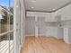 Small galley kitchen with white cabinets and access to a deck at 181 E 108Th Ave, Northglenn, CO 80233