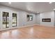 Living room with hardwood floors, fireplace, and French doors at 181 E 108Th Ave, Northglenn, CO 80233