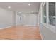 Open living room with hardwood floors and access to backyard at 181 E 108Th Ave, Northglenn, CO 80233
