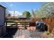 Large backyard featuring a well-maintained lawn, wood fence, and a charming play area with a swing set at 1891 S Madison St, Denver, CO 80210