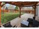 Backyard deck with seating area overlooking a lawn, storage shed and an outdoor lounge area at 1891 S Madison St, Denver, CO 80210