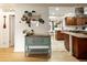 Stylish dining area with decorative mirror accents and open flow to the adjacent kitchen at 1891 S Madison St, Denver, CO 80210