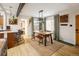Elegant dining area with an open floor plan, featuring stylish decor and ample natural light at 1891 S Madison St, Denver, CO 80210