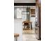 Bright dining area with contemporary lighting and open access to the kitchen at 1891 S Madison St, Denver, CO 80210
