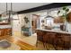 Open dining and kitchen area with seamless flow, island seating, and stylish furnishings at 1891 S Madison St, Denver, CO 80210