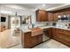 Kitchen with copper sink, granite countertops, stainless steel appliances, and access to the backyard at 1891 S Madison St, Denver, CO 80210