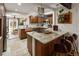 Kitchen showcases wood cabinets, granite countertops, stainless steel appliances, island, and copper sink at 1891 S Madison St, Denver, CO 80210
