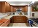 Well-equipped kitchen featuring custom cabinetry, granite countertops, and modern appliances at 1891 S Madison St, Denver, CO 80210