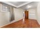 Cozy bedroom with hardwood floors, ceiling light, and closet space at 2515 Ames St, Edgewater, CO 80214