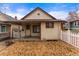 Charming home with a front porch, white picket fence, and landscaped front yard at 2515 Ames St, Edgewater, CO 80214