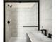 Sleek bathroom showcasing a black-framed glass shower and a modern vanity with contemporary fixtures at 9185 W Eaton St, Westminster, CO 80031