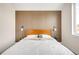 Chic bedroom features wood slat accent wall, modern decor, and ample natural light at 9185 W Eaton St, Westminster, CO 80031