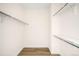 Walk-in closet featuring built in shelving and modern wood flooring at 9185 W Eaton St, Westminster, CO 80031