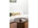 Close up of the living room with modern coffee table and plush white sofa with animal print pillows at 9185 W Eaton St, Westminster, CO 80031