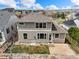 Aerial view of backyard, home exterior, patio, professional landscaping and neighborhood at 11704 Hale Ct, Parker, CO 80138