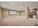 Finished basement with a projector screen, wet bar, and carpet at 11704 Hale Ct, Parker, CO 80138