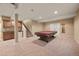 Finished basement features a pool table, kitchenette, and easy access to the upper floors at 11704 Hale Ct, Parker, CO 80138