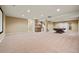Spacious finished basement featuring a wet bar, pool table area, and plenty of open space for recreation at 11704 Hale Ct, Parker, CO 80138