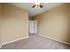 Neutral bedroom with carpet floors and a closet with natural light coming in through window at 11704 Hale Ct, Parker, CO 80138