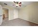 Bedroom featuring neutral carpet, a ceiling fan, and a sliding door closet at 11704 Hale Ct, Parker, CO 80138