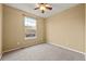 Neutral bedroom with carpet floors and a window offering natural light and outdoor views at 11704 Hale Ct, Parker, CO 80138