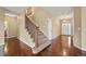 The foyer has hardwood floors, a staircase, and a view of the front door and front of the home at 11704 Hale Ct, Parker, CO 80138
