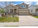 Charming two-story home featuring a covered porch, well-maintained lawn, and inviting curb appeal at 11704 Hale Ct, Parker, CO 80138
