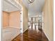 Entry hallway with hardwood floors leading to a carpeted room and other living spaces at 11704 Hale Ct, Parker, CO 80138