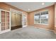 Spacious office featuring neutral carpet, ample light, and glass French doors at 11704 Hale Ct, Parker, CO 80138