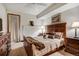 Cozy bedroom with wooden furniture, soft lighting, and a comfortable bed at 34 Highfield Trl # 112, Breckenridge, CO 80424