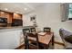 Dining area adjacent to kitchen with an elegant table, chairs and convenient layout at 34 Highfield Trl # 112, Breckenridge, CO 80424