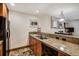 Well-equipped kitchen with granite countertops, stainless sink, and modern appliances at 34 Highfield Trl # 112, Breckenridge, CO 80424