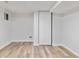 Basement area with wood-look flooring, bright lighting, and a large closet at 4003 Federal Blvd, Denver, CO 80211