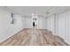 Spacious basement with laminate flooring, and access to the laundry and kitchen at 4003 Federal Blvd, Denver, CO 80211