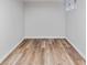 Bright basement area with wood-look flooring and clean, neutral walls at 4003 Federal Blvd, Denver, CO 80211