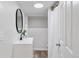 Bathroom featuring a modern vanity, mirror, and shower with a neutral color palette at 4003 Federal Blvd, Denver, CO 80211
