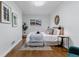 Cozy bedroom with a comfortable bed, stylish decor, and ample natural light at 4003 Federal Blvd, Denver, CO 80211