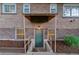 Exterior basement entrance with covered overhang and access stairs at 4003 Federal Blvd, Denver, CO 80211