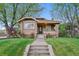 Charming brick home with a well-maintained front yard and inviting entrance at 4003 Federal Blvd, Denver, CO 80211