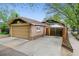 A detached garage with a brick exterior sits at the end of a long driveway with fencing at 4003 Federal Blvd, Denver, CO 80211